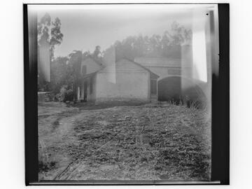 Unidentified house and concrete tunnel or bridge