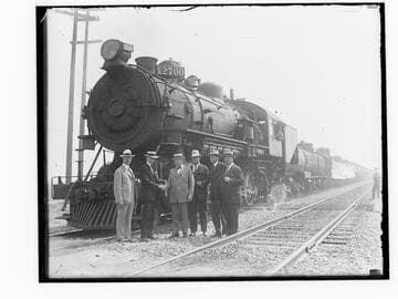 Locomotive X2700 and train with six unidentified men