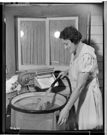 Mrs. _ and washing machine for fair exhibit