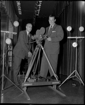 Two cinematographers and camera set