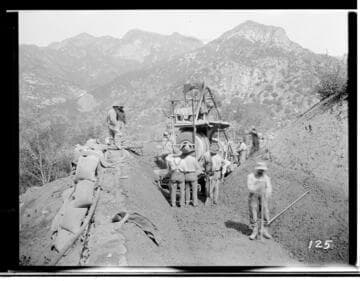 A construction crew using an electric powered mixer to prepare the concrete to line the ditch which will carry water to Kaweah #3 Hydro Plant