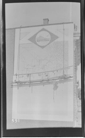 A map of Tulare and Kern Counties while being painted on the exterior wall of the Visalia Local Office Building