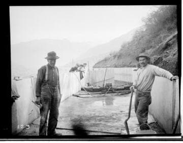 View of the construction crew concreting the ditch with the plaster coat at Kaweah #3 Hydro Plant