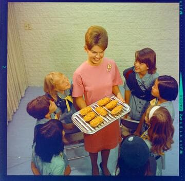 Home Economist Hillary Guild with group of Girl Scouts