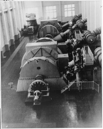 Interior view of Big Creek Powerhouse #2a shows the large Pelton wheels flanking each of the plant's two generating units