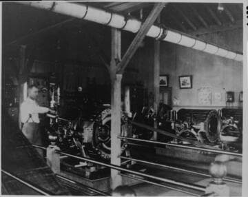 The interior of the Steam Plant of the Santa Barbara Electric Light Company, about 1887, showing Tony De La Torre, plant engineer