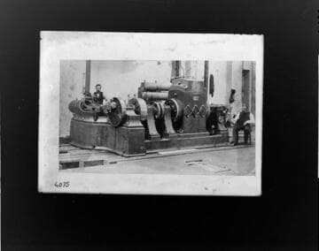 An operator standing by one of the original "Jumbo" dynamos installed at Thomas Edison's Pearl Street Plant in New York City, 1882