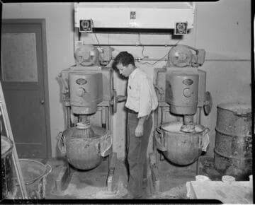 Man running mixing machines