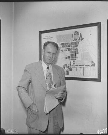 Man with paperwork standing next to map of South Pasadena