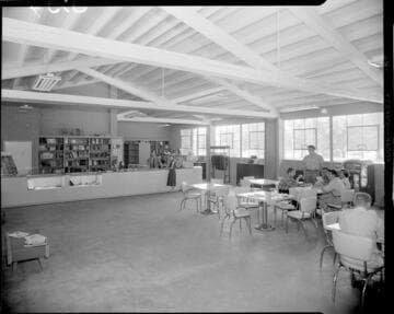 Large room with a service counter with books and postcards