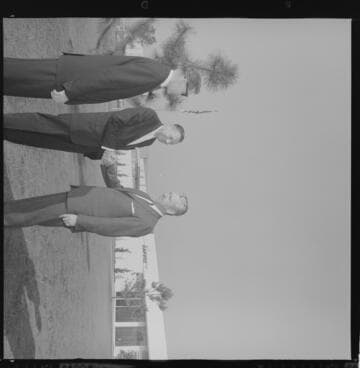 Architects reviewing plans and visiting project site by Harvill building