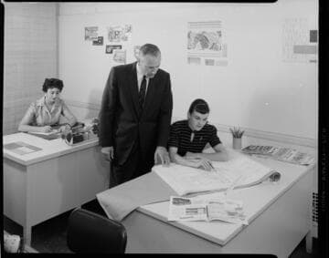 Home designers working with plans