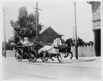 Los Angeles Fire Department Engine #14 at full speed on a city street, ca. 1910