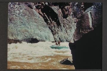 Jack Brennan driving boat through Cisco Bend