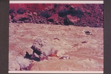 Dock Marston putting the "Joan" thru Hance Rapid. Bright Angel gauge: 27,200 cfs