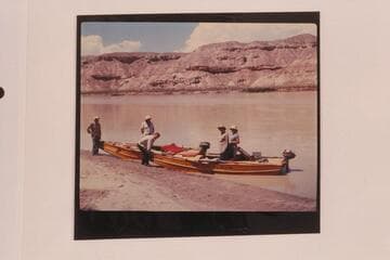 Harris-Brennan party on the Green River. Brennan is at left and Harris is in red cap