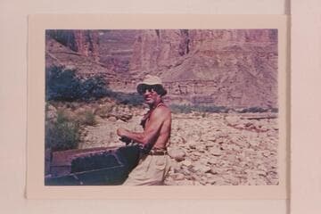 Dock Marston. With the wreck of a skiff found in the drift pile. At Nancoweap Creek--Marble Canyon. First River trip for Marston