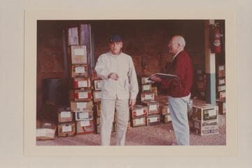 Ed I'Anson and Dock Marston work over the groceries