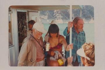 Dock Marston at left and Jim Jordan at right on Jim's houseboat on Lake Mead.  The middle figure is one of the Grand Canyon Expedition party and probably Mrs. Pierce