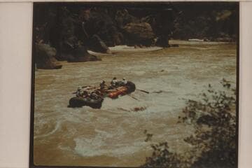 One of the Hatch pontoons in tail waves of Triplet Rapid; Canyon of Lodore.  Frank Hatch and Dave Allan, boatmen.  Passengers are members of Appalachian Mountain Club