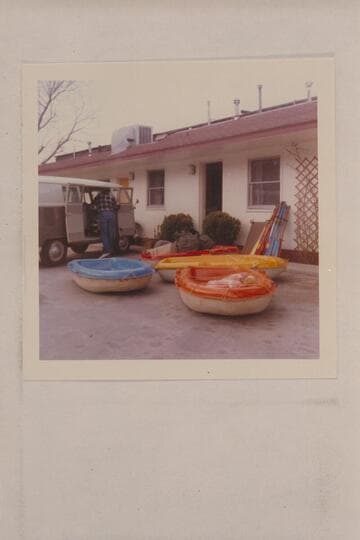 Bill Belknap unloading Sportyaks and gear from the Volkswagon. Moab, Utah