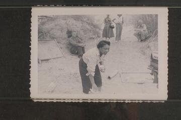 Lodell Matthews offers a drink of cold water. Preston Mercer sitting left. Dick Spring sitting right. Margaret Marston and Dudy Thomas background center. Lees Ferry