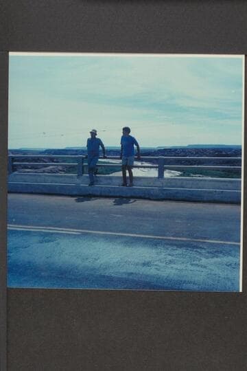 Nathan Marston and Jim Jordan on new highway bridge at Cameron. Upstream on river flowing mud