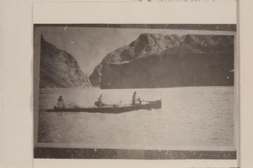 Al Jagerson at wheel of tunnel boat built in fall of 1921.  Below Bonelli Landing.  Crew probably John Shull and Murl Emory
