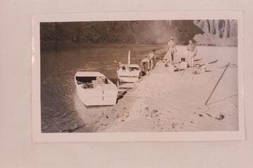 On the Colorado near Mile 23. Leaning over is Sam Stone, then Frank E. Frost, Robert L. Gates and San Juan Jack. Second trip of Frost Expeditions on the San Juan River