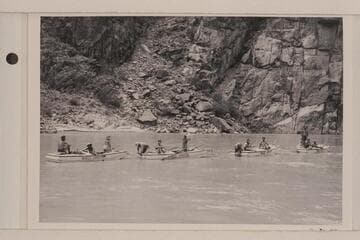 The four Nevills skiff and their passengers at the end of the Nevills' final run of Grand Canyon. L to R: Anspach, Reilly, Kendall, Wright, Anspach, Abbott, Jim Rigg, Joan Nevills, Nevills (standing), Ruth Rigg and Masland