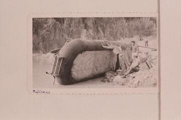 Patching one of the Bus Hatch boloney boats at Phantom Ranch.  Bob Bader standing at right
