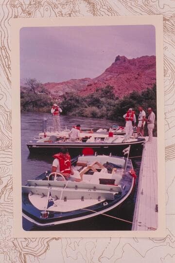 The three Bureau of Reclamation TurboCraft and crew at the dock at Lees Ferry prior to departure. Buzz Belknap is in the foreground. Bill Gardner, Jim Jordan, Dock Marston, Jim Bechtel, and Earl Komie