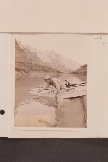Randall Henderson measuring river temperature; Nevills Grand Canyon party of 1947, July