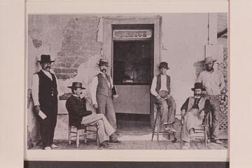 Captain Polhamus sits in the chair at the right