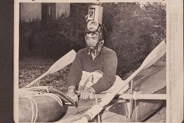 Leslie Jones.  At the oars of his boat "Honey, The Rapids Queen."
