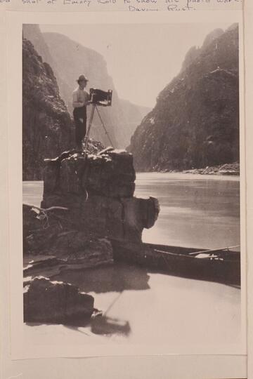 Emery Kolb photographing in the Grand Canyon near Bright Angel Creek.  One of Dave Rust's folding canvas boats is at right