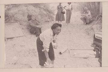 Lodell Matthews offers a drink of cold water. Preston Mercer sitting left. Dick Spring sitting right. Margaret Marston and Dudy Thomas background center. Lees Ferry