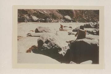 Lining a Nevills sadiron at Vulcan Rapid. Nevills sits on the stern. Garth Marston strains on the stern line