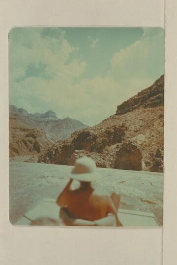 Margaret Marston riding the stern of the "Joan". Joe Desloge was at the oars