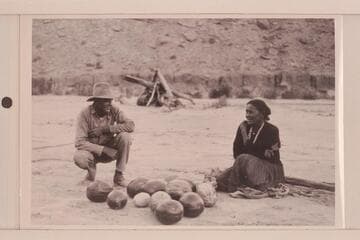 Hyde and Indian squaw, both smiling. Camp at mouth of Piute. USGS San Juan survey