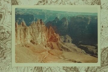 Air photo of Meriwitica Canyon showing spring at lower right and cave at middle of wall at left. Grand Canyon is in the background