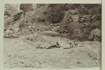 Jim-Bob Rowland at the wheel of the deck boat in Vulcan Rapid. Dave Whiting and Wes Hildreth are passengers. One motor drowned in the run