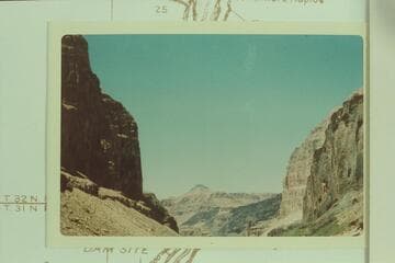 Down river from Mile 186.5 to the lava flow at the mouth of Queantoweap Valley. The Whitmore trail drops from the rim of lava near the light spot