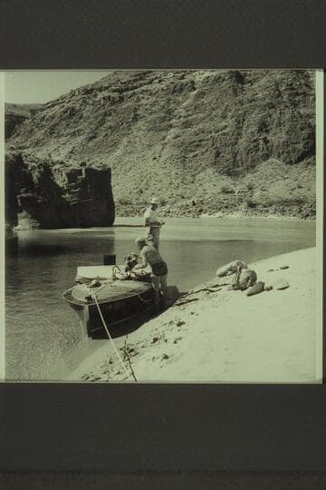 The Chris-Craft in the lagoon at the mouth of Tapeats Creek. Guy Forcier stands on the after deck while Dock Marston stows gear