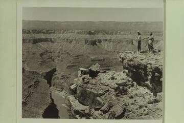 Maradel and Margaret Marston looking down into Marble Canyon from near the top of the cable. The motorboat crew are camped below on the right bank of the river near Mile 41