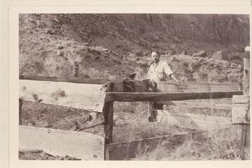 Charles Kelly at Cass Hite's grave, Tickaboo. Cass Hite died in 1914