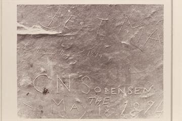 Inscription on huge rock in high cave west of Schock Trail, near Mile 111, north bank. The Schock Trail was built by Dr. Schock