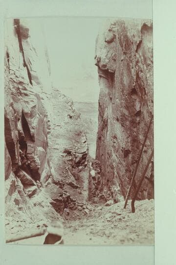 Appears to be Hole-in-the-Rock. The development of the dredging enterprise of the Hoskaninni Company included some work at Hole-in-the-Rock. Property included a cook stove and some pipe at this place in 1901. From Stanton Collection of Photos