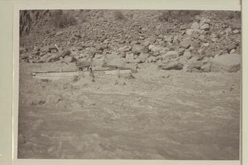 Hugh Cutler putting the "Mexican Hat II" through Dubendorff Rapid. The oar action by Cutler appears to be a braking