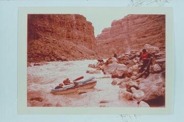 Dock Marston lining a Yak in Dark Canyon Rapid. Jorgen Visbak and Buzz Belknap in distance